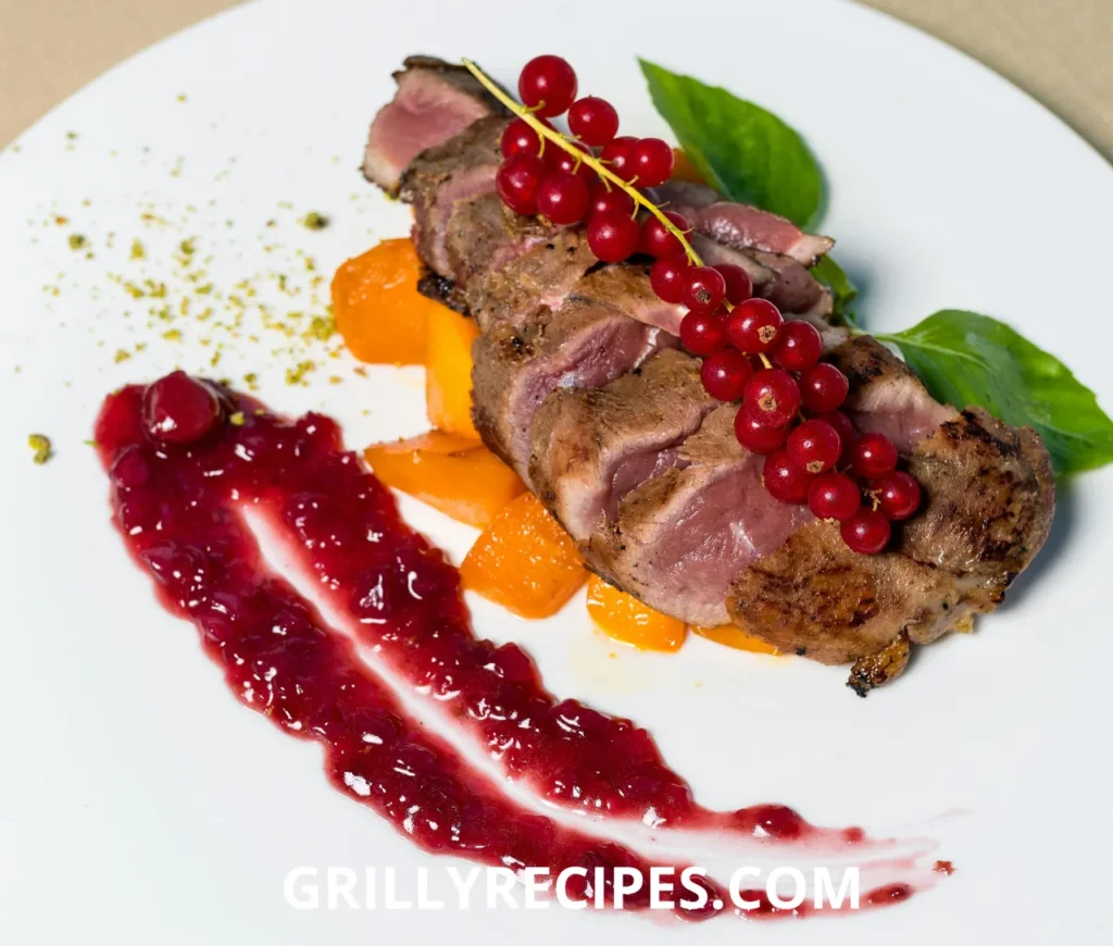Juicy grilled beef sirloin steak on a wooden cutting board with herbs.

