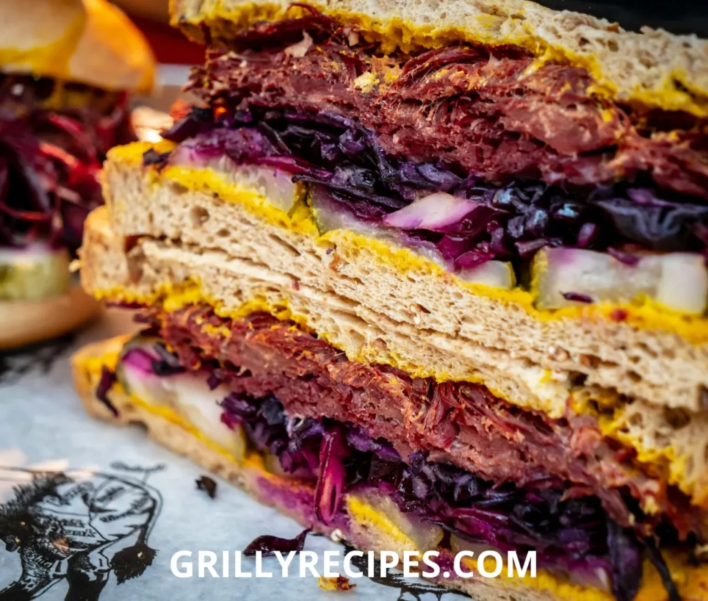 Delicious corned beef sandwich with melted cheese on rye bread.

